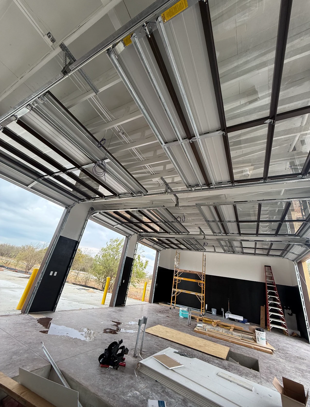 Interior view of commercial sectional overhead doors and tracks from an Overhead Door Pros job